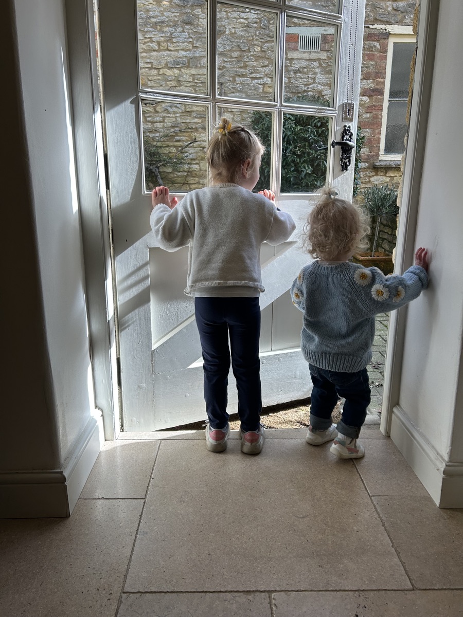 Allison's two daughters at a doorway.